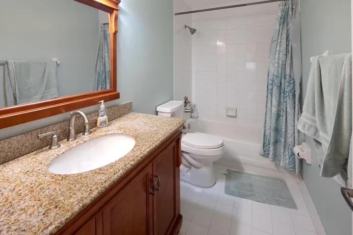 Full guest bathroom conveniently located near the secondary bedrooms with a combination tub and shower.