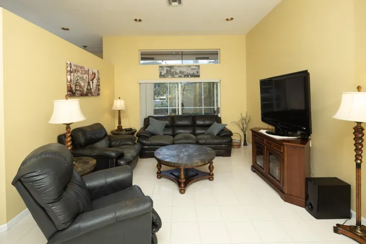 Comfortable family room with an open layout, abundant natural light, and easy access to the kitchen and outdoor living areas.