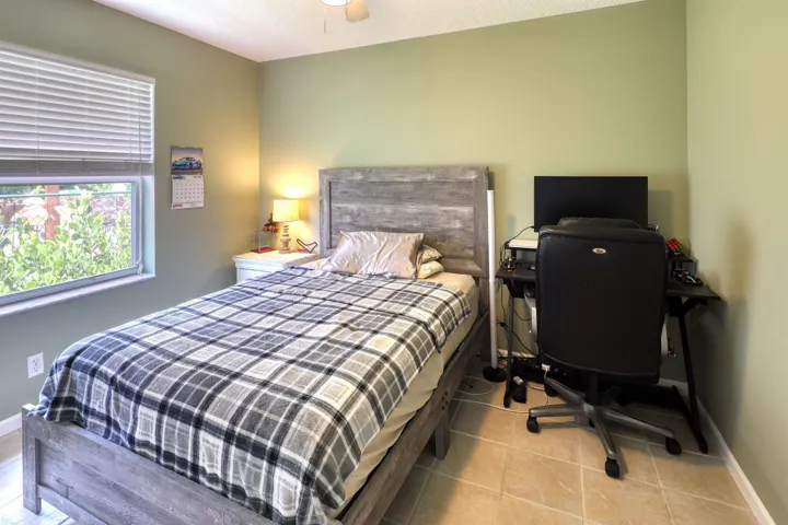 Comfortable fourth bedroom offering flexibility for guests, a home office, or hobby room.
