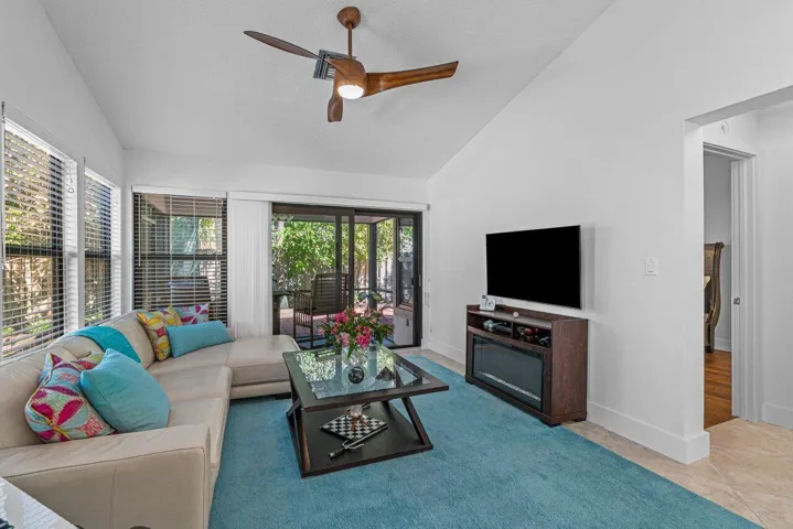 LIVING ROOM OPENS TO PATIO