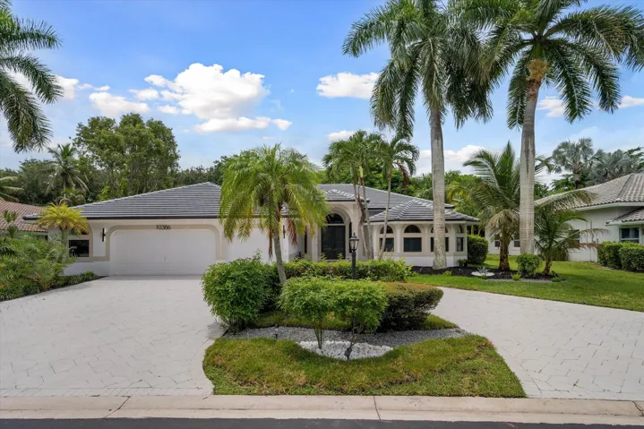 Welcome home: circular driveway, pretty landscaping!