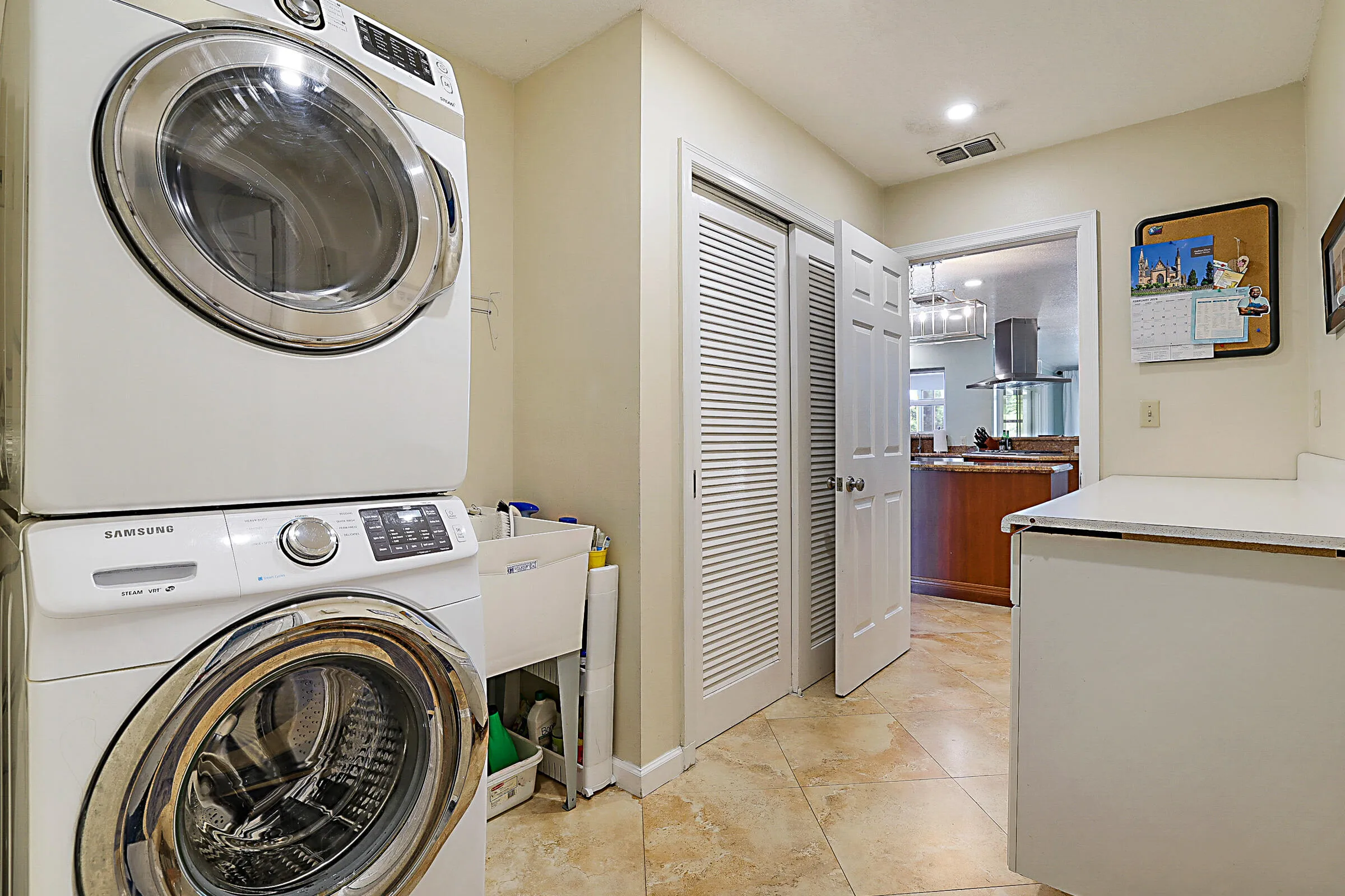 Stacked washer/dryer and plenty of counter space for folding clothes