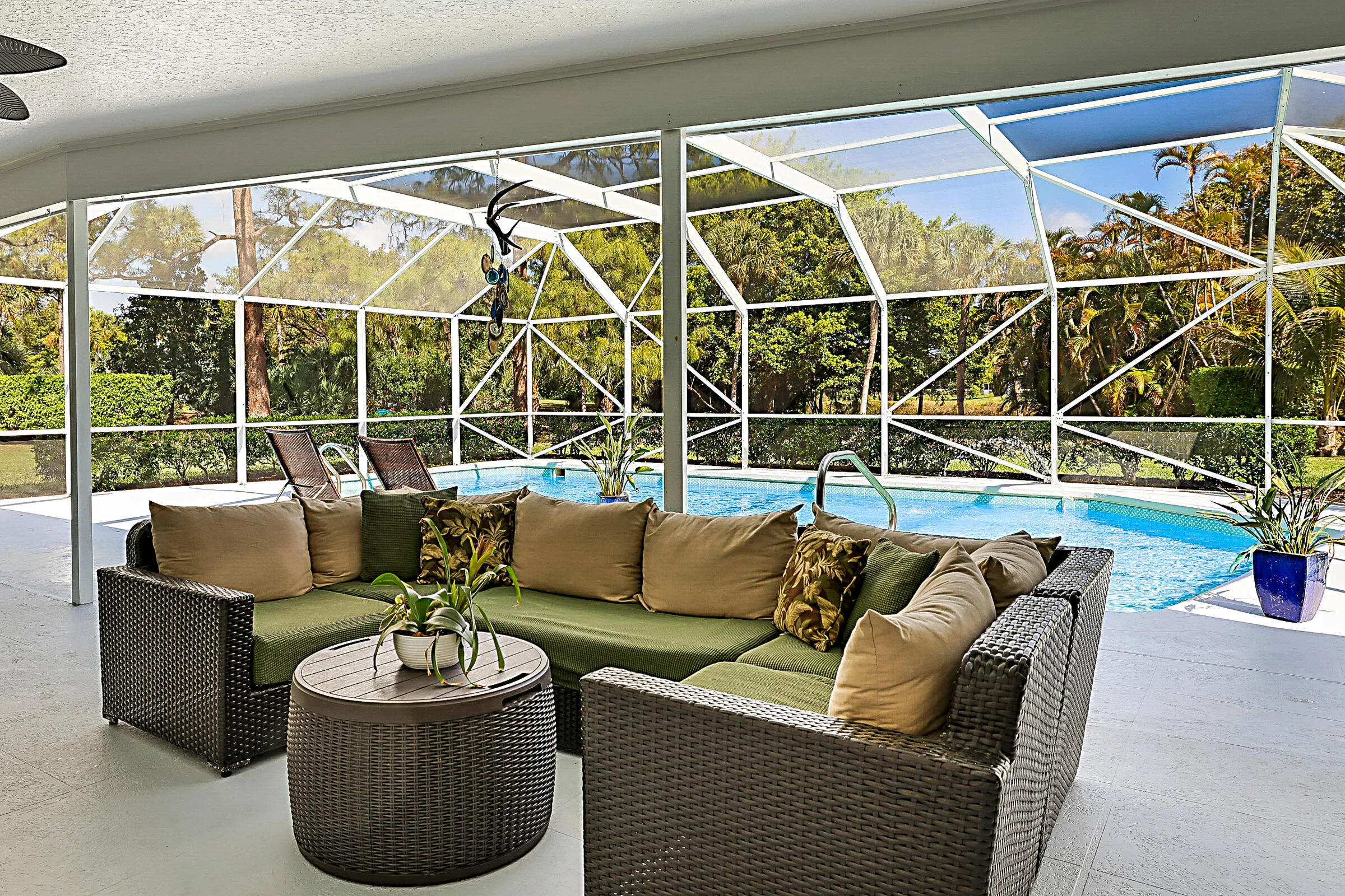 Complete outdoor living under this expansive covered patio and screen enclosure