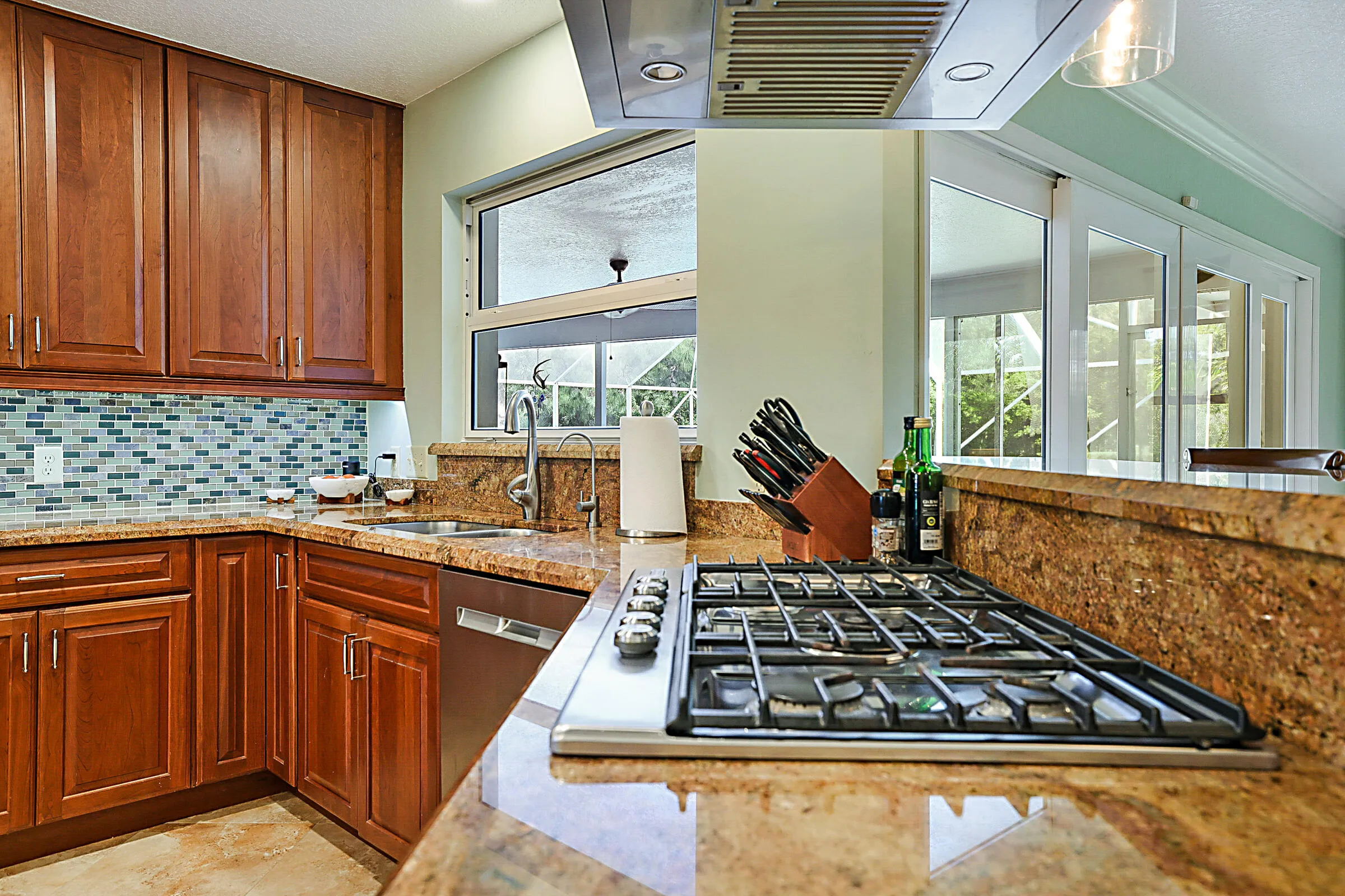 Keep the conversation flowing with guest seating overlooking the stove and kitchen