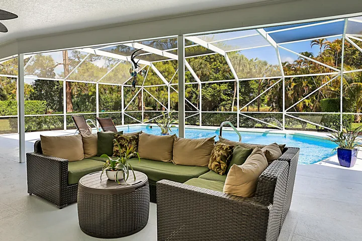 Complete outdoor living under this expansive covered patio and screen enclosure