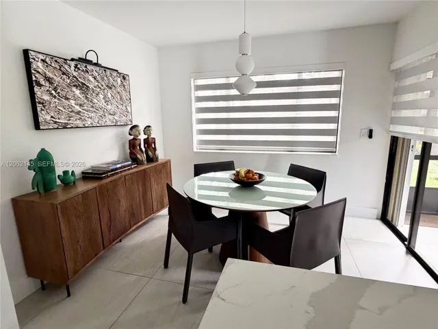 Dining Area Off Kitchen and Living With Direct Opening to Patio