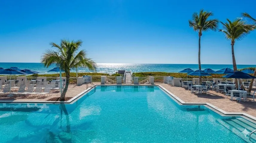Experience coastal serenity at the Beach Club, where your private beach retreat, sun-drenched pool deck, and sophisticated oceanfront bar and dining await.