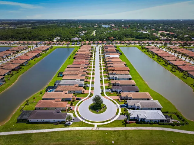 Aerial perspective showcasing a residential development with numerous single-story homes