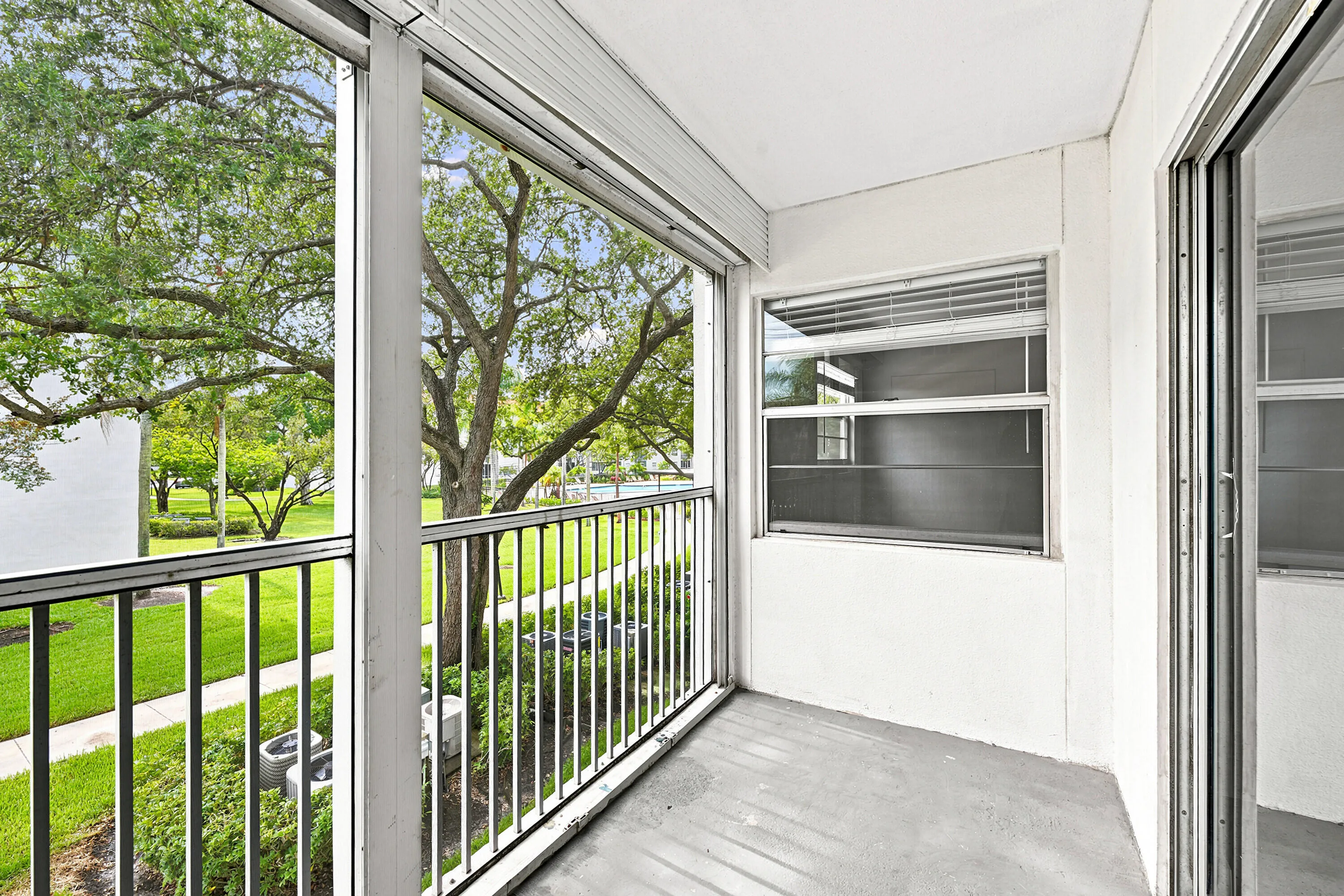 Screened Balcony with Pool Views