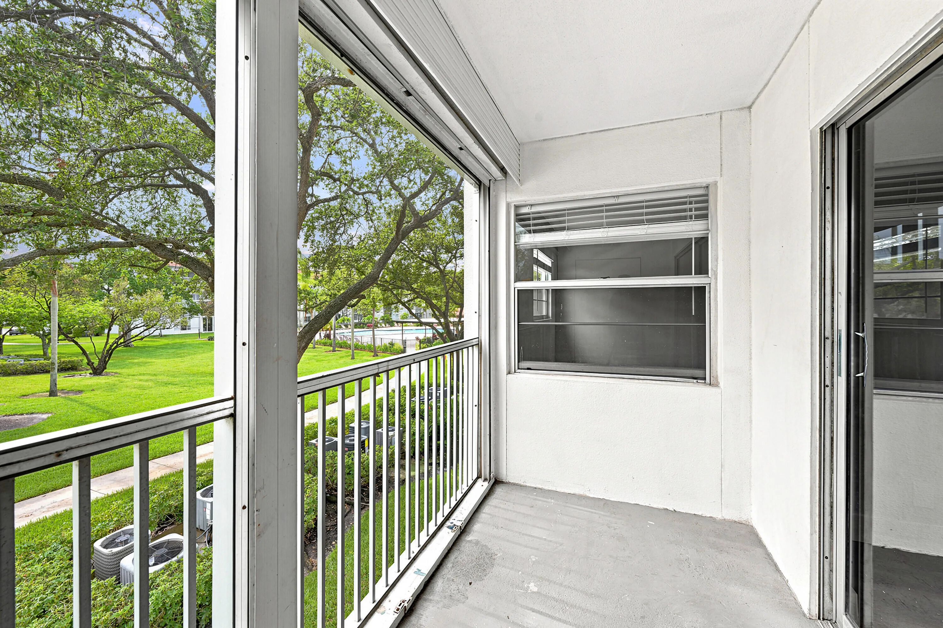 Screened Balcony with Pool Views