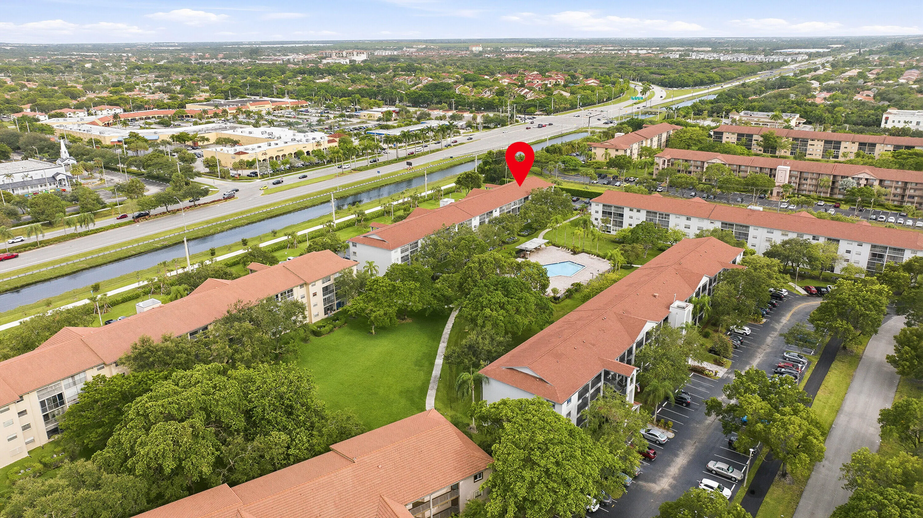 Aerial & Water View of Building & Pool