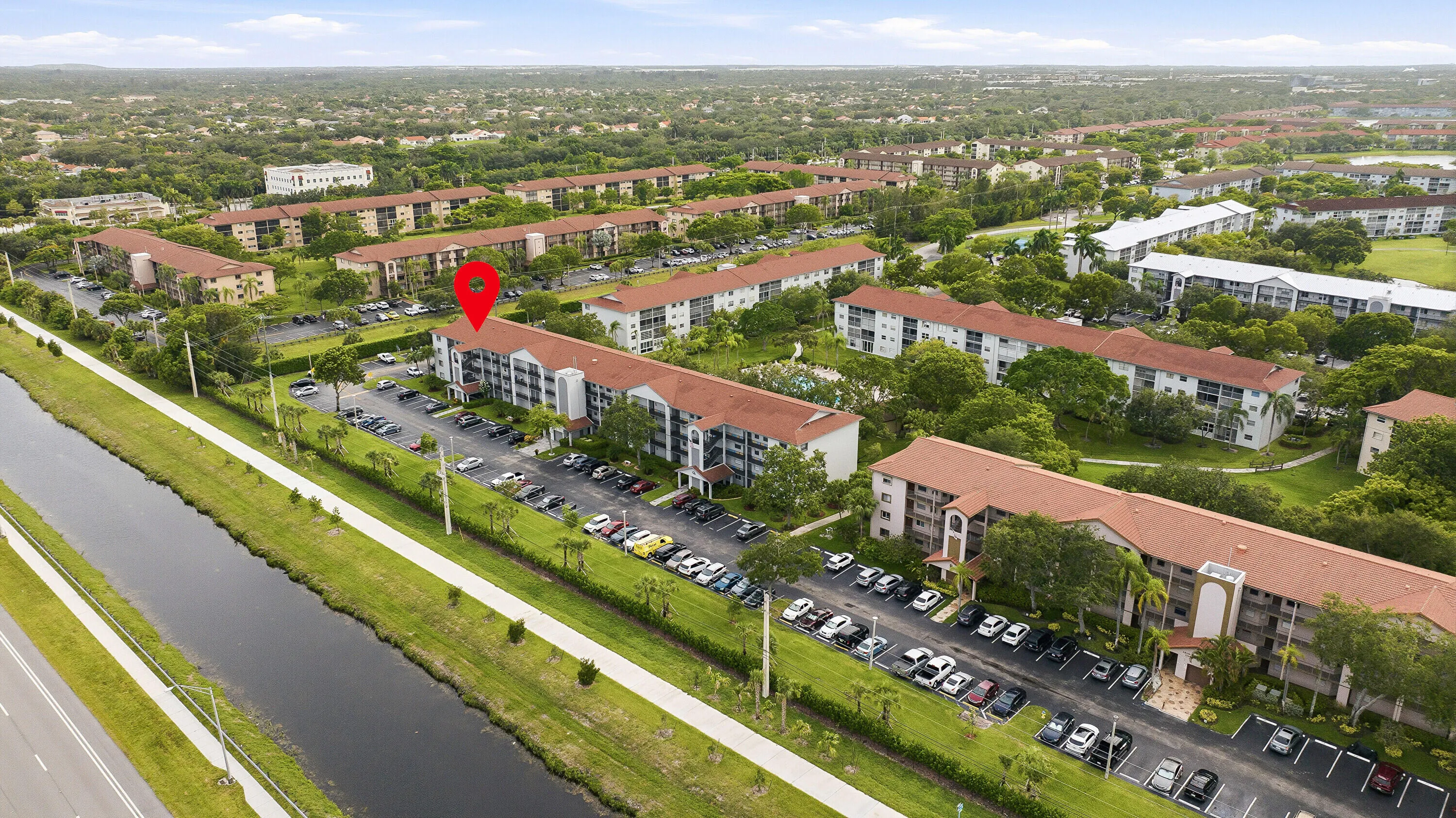 Aerial & Water View of Building & Pool
