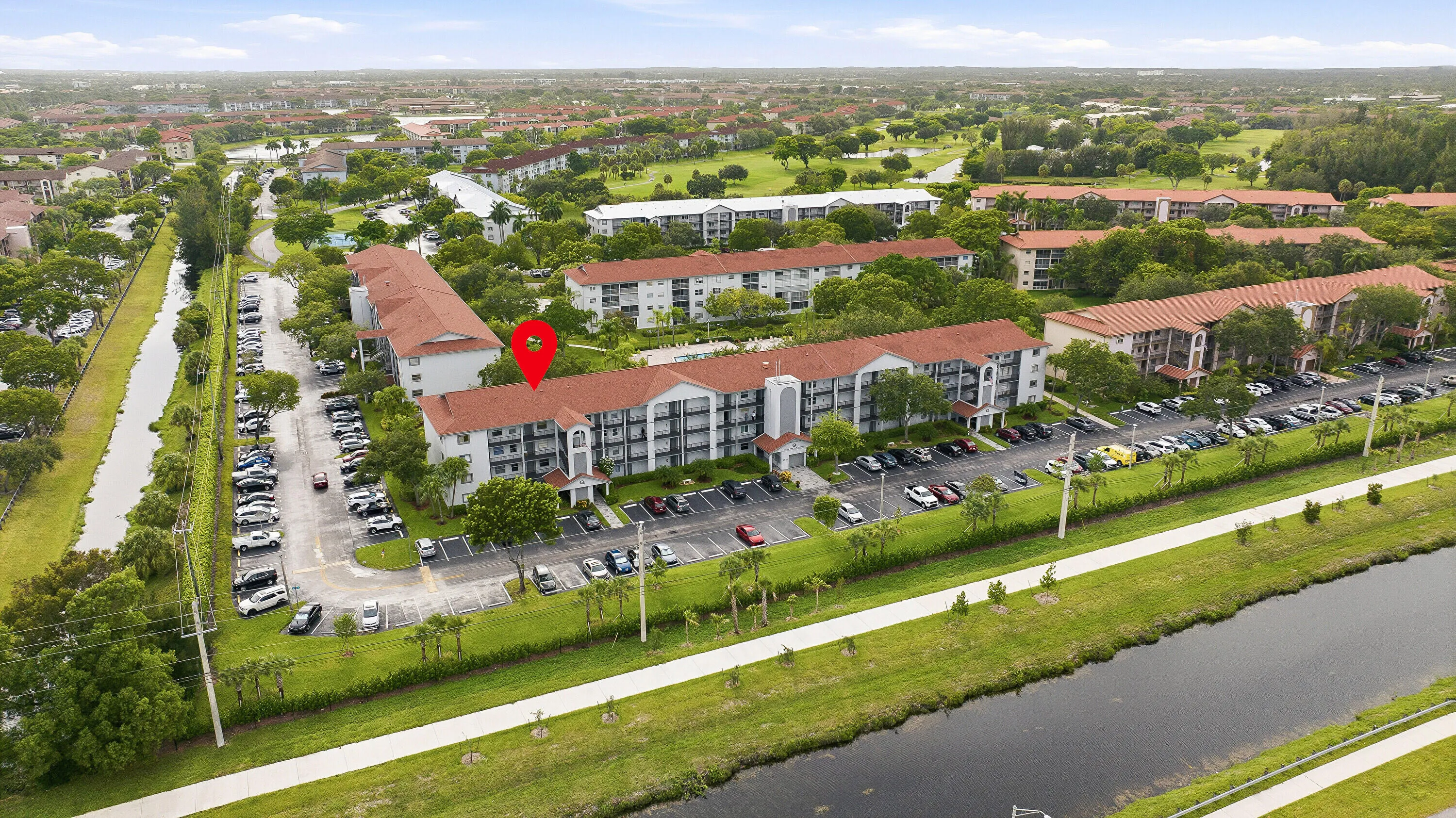 Aerial & Water View of Building & Pool
