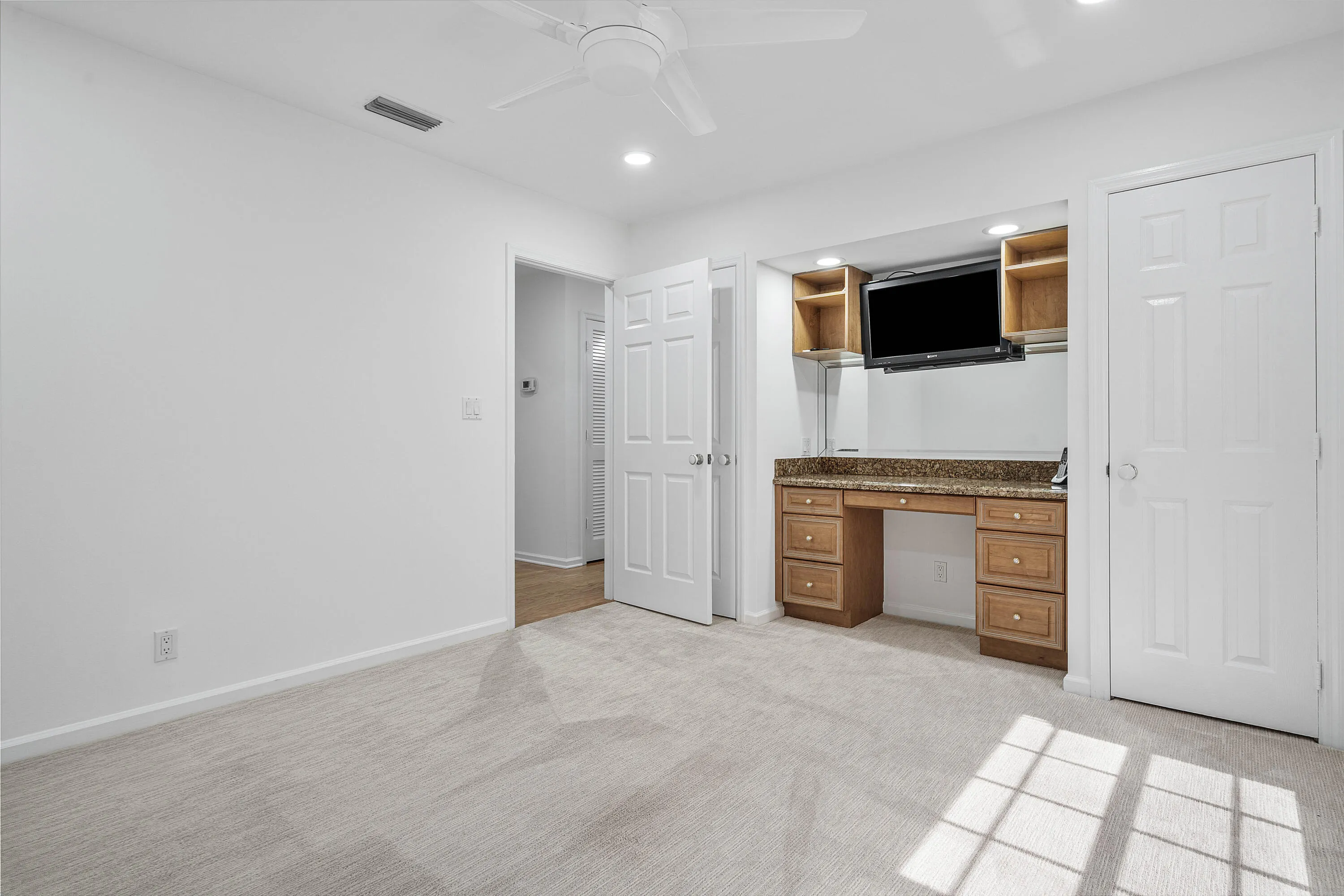 GUEST BEDROOM WITH DUAL CLOSETS & DESK