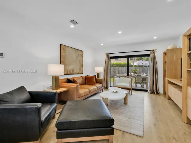 Large, Bright Living with Sliding Doors to the Breezy Screened-in Patio