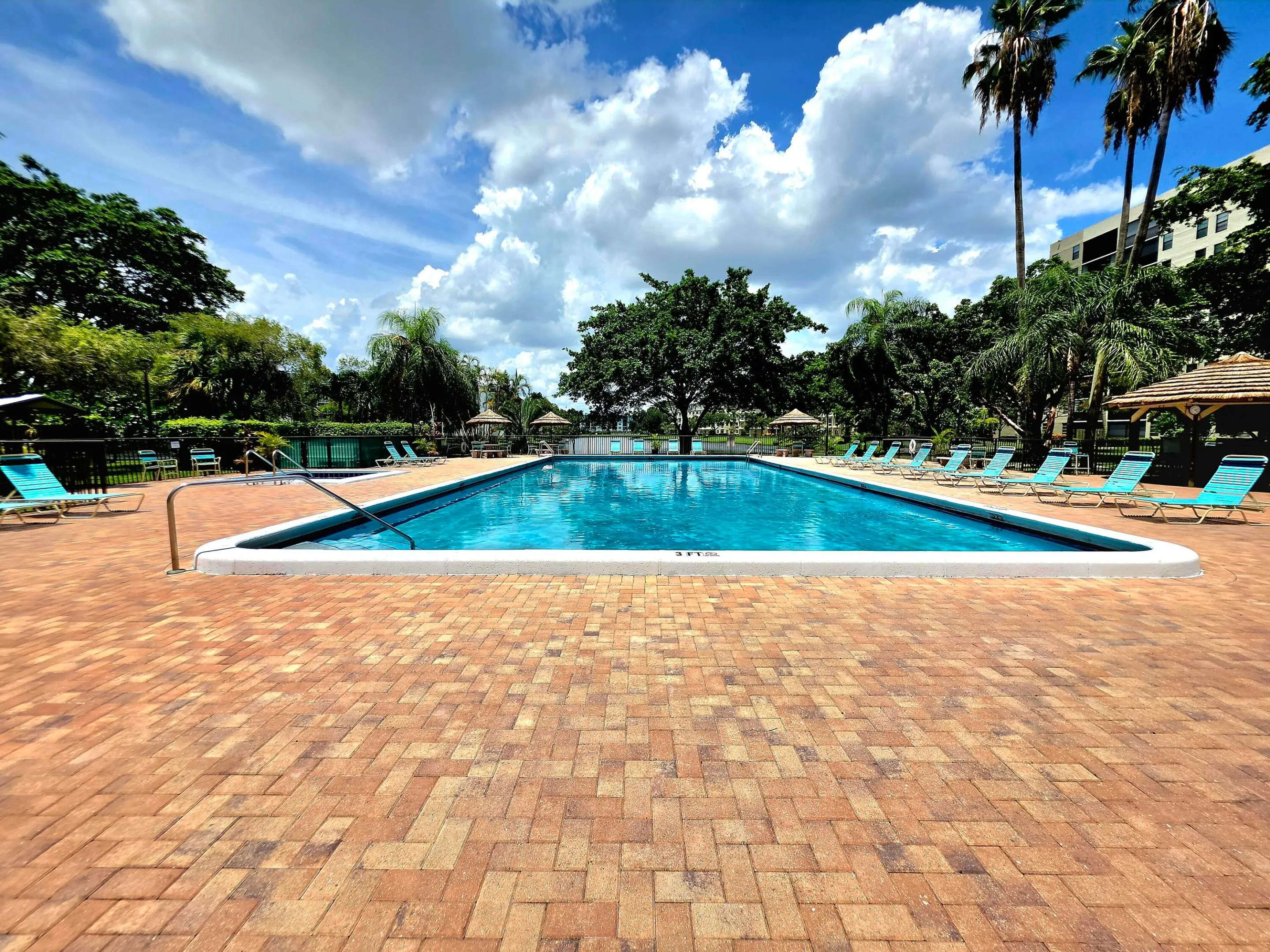 YOUR COMMUNITY POOL WITH A LAKE VIEW