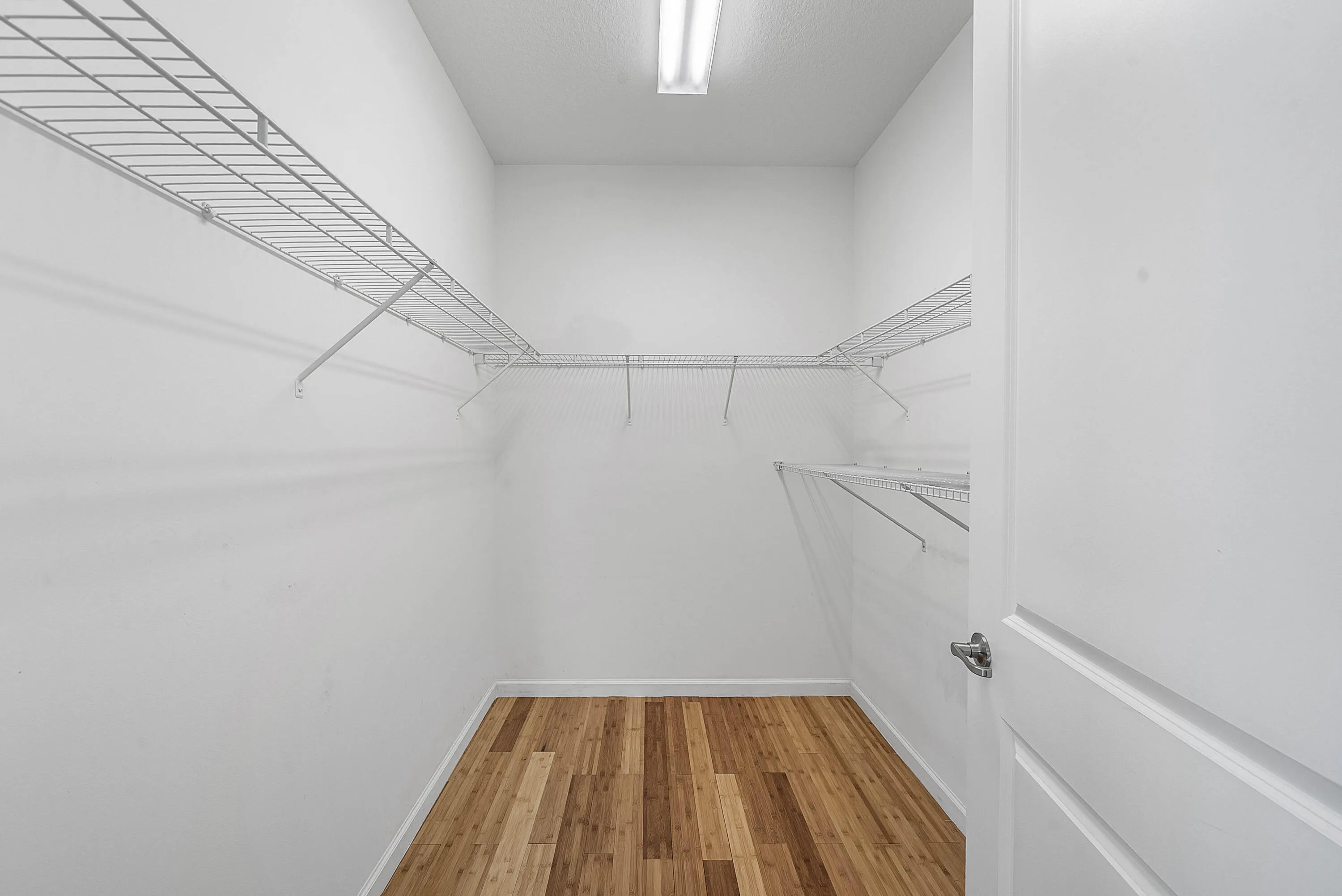 Walk in closet primary bedroom