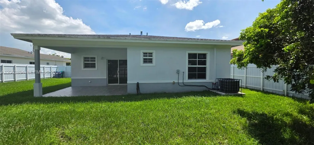Covered Patio and Spacious Back Yard
