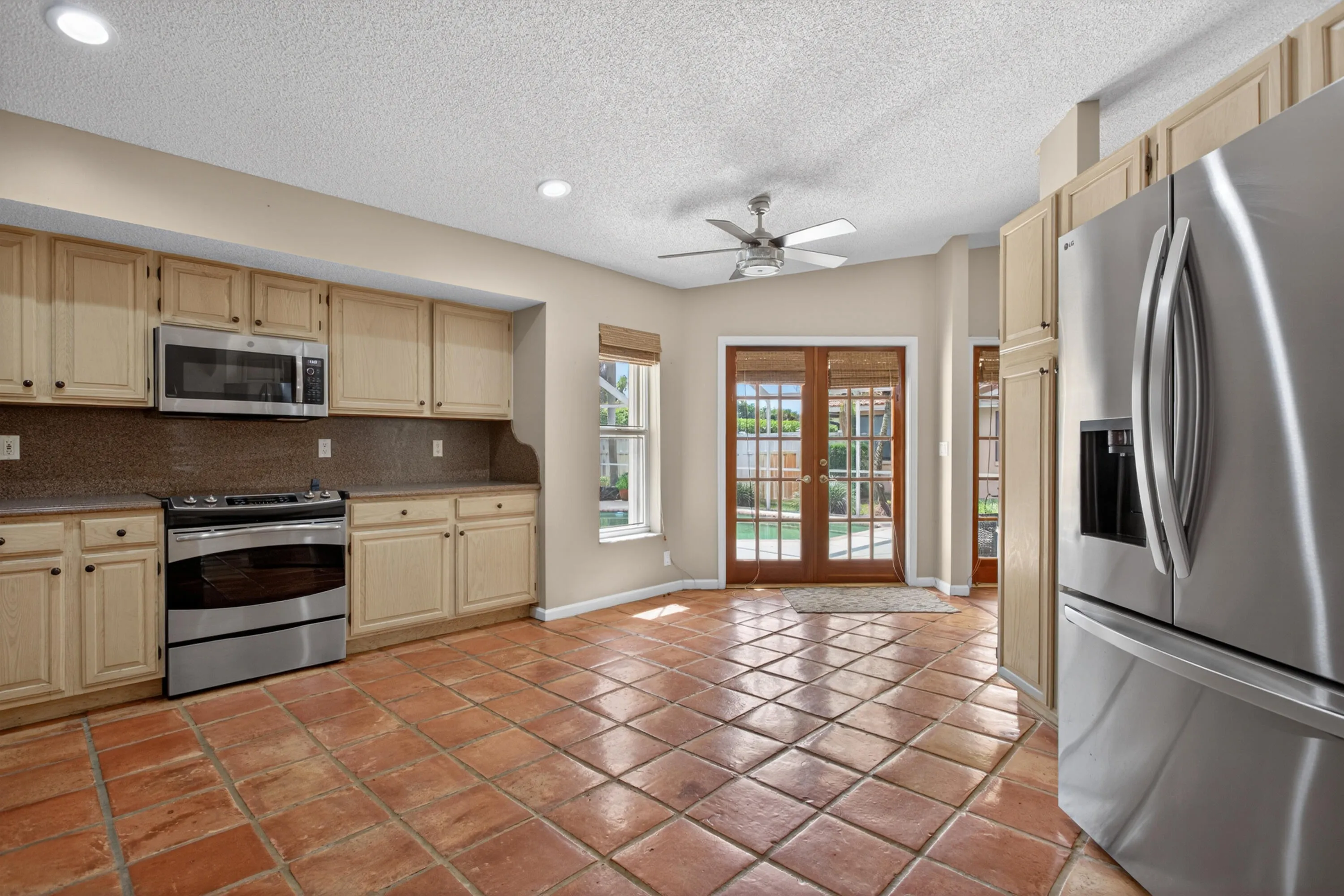 Spacious kitchen with new stainless steal appliances.