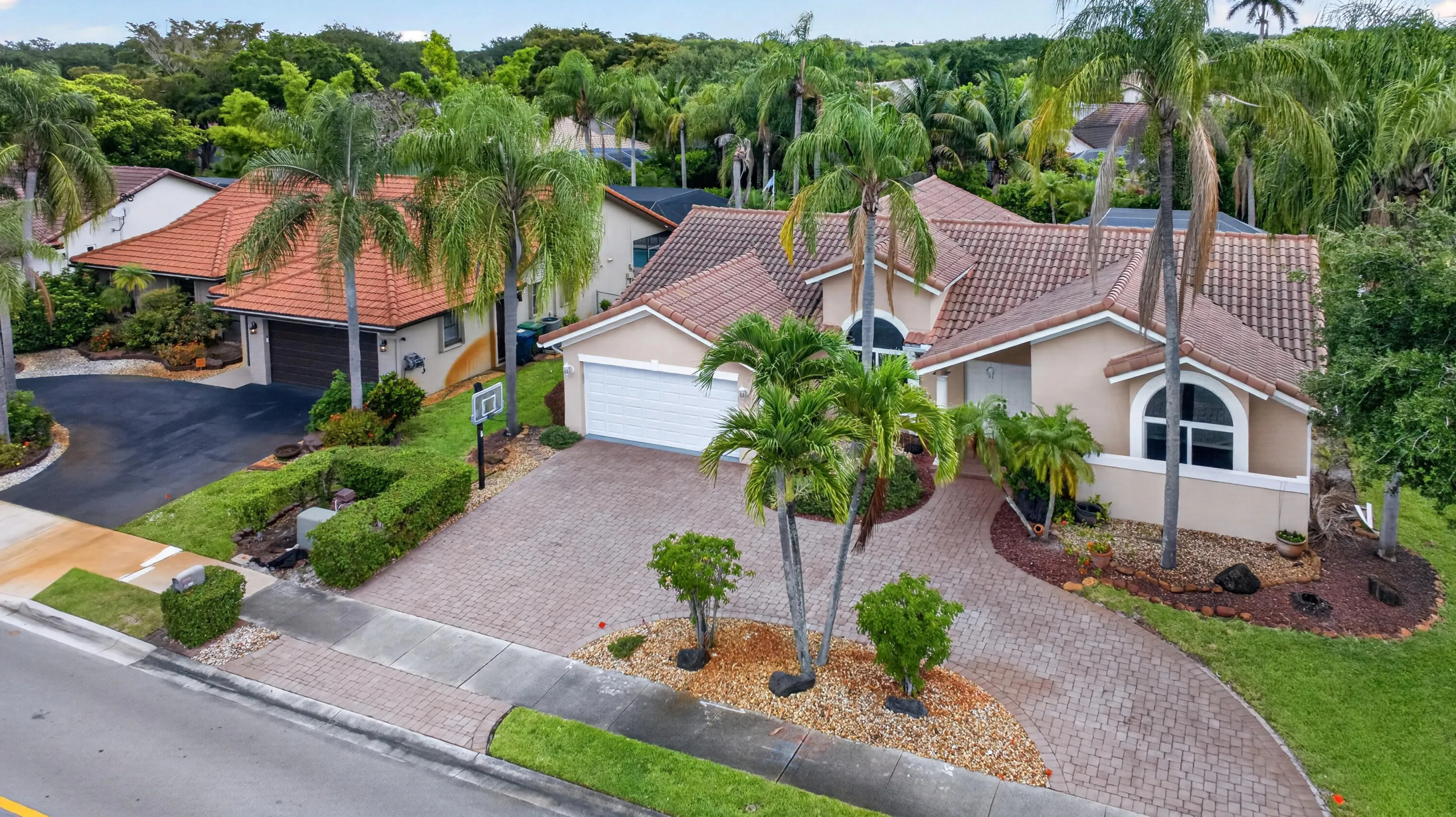 This home features a 2 car garage and circular drive, and a partial impact windows and doors.