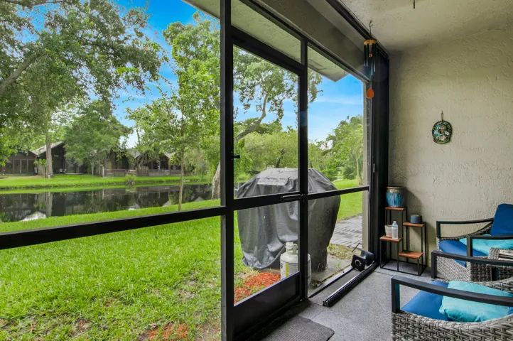 ample screened in patio with storage closet