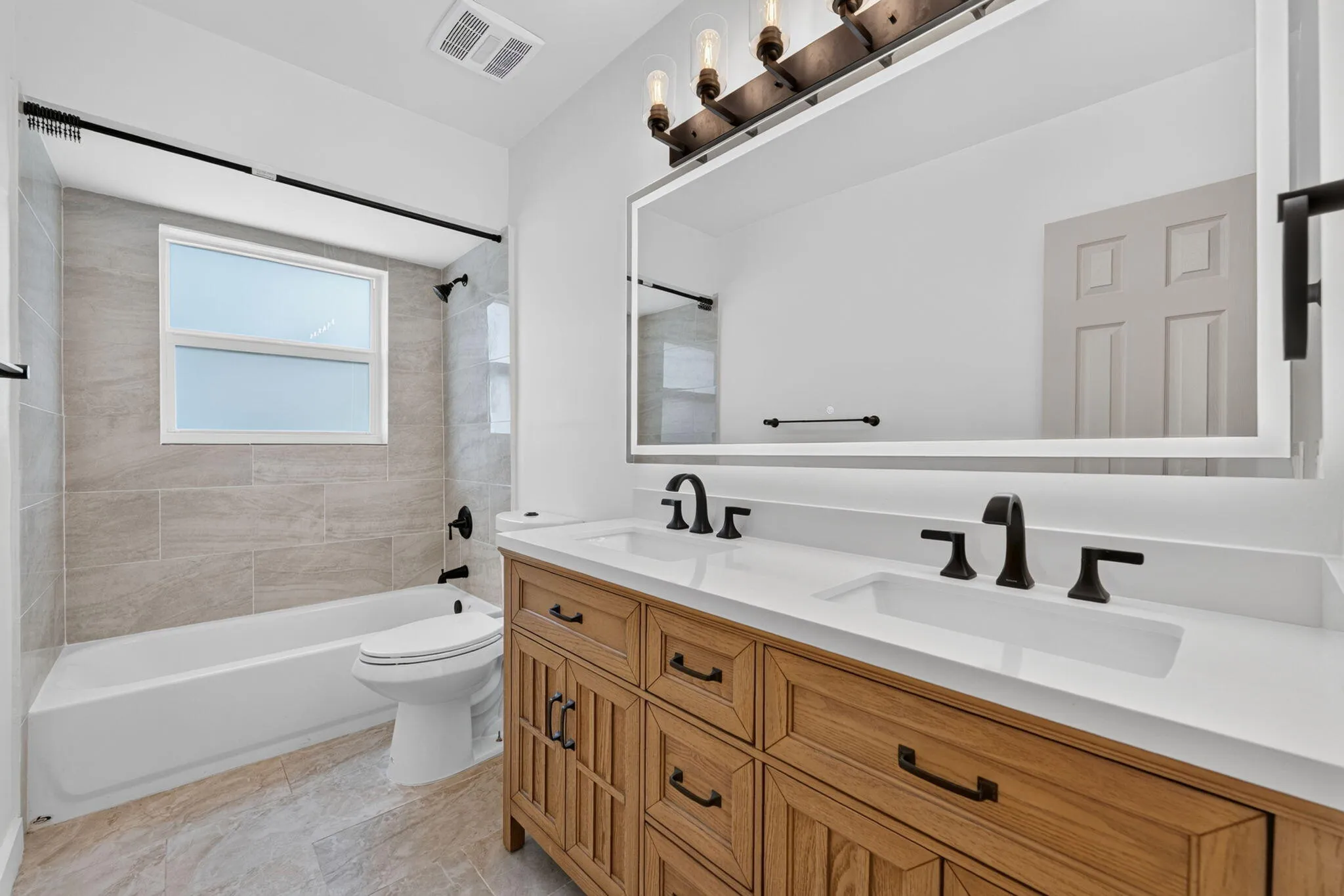 GUEST FULL BATH WITH DUAL SINKS AND SHOWER TUB COMBO