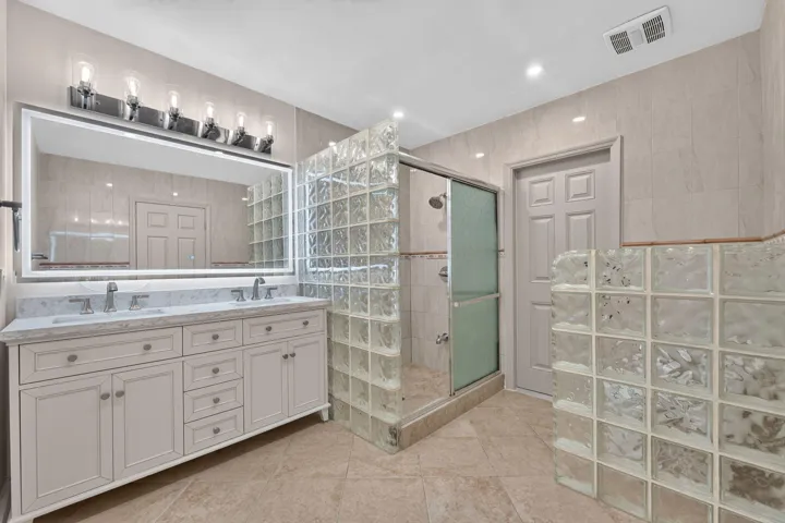 PRIMARY BATH/ CABANA BATH WITH DOUBLE SINKS AND BACKLIT MIRROR
