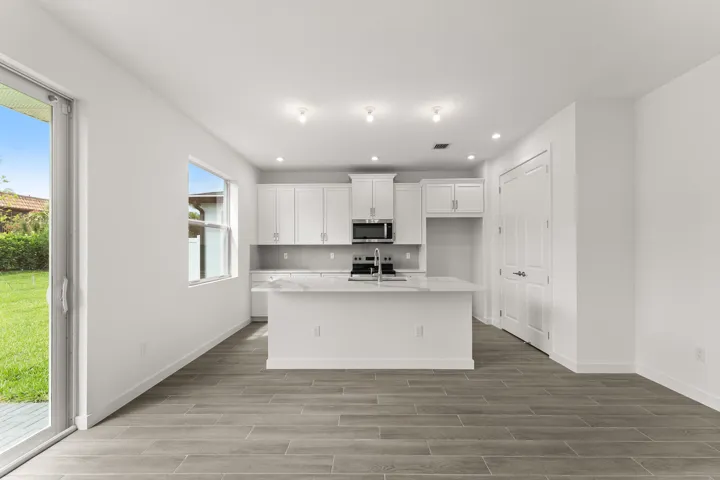 Stock photos represent builder's floorplan
