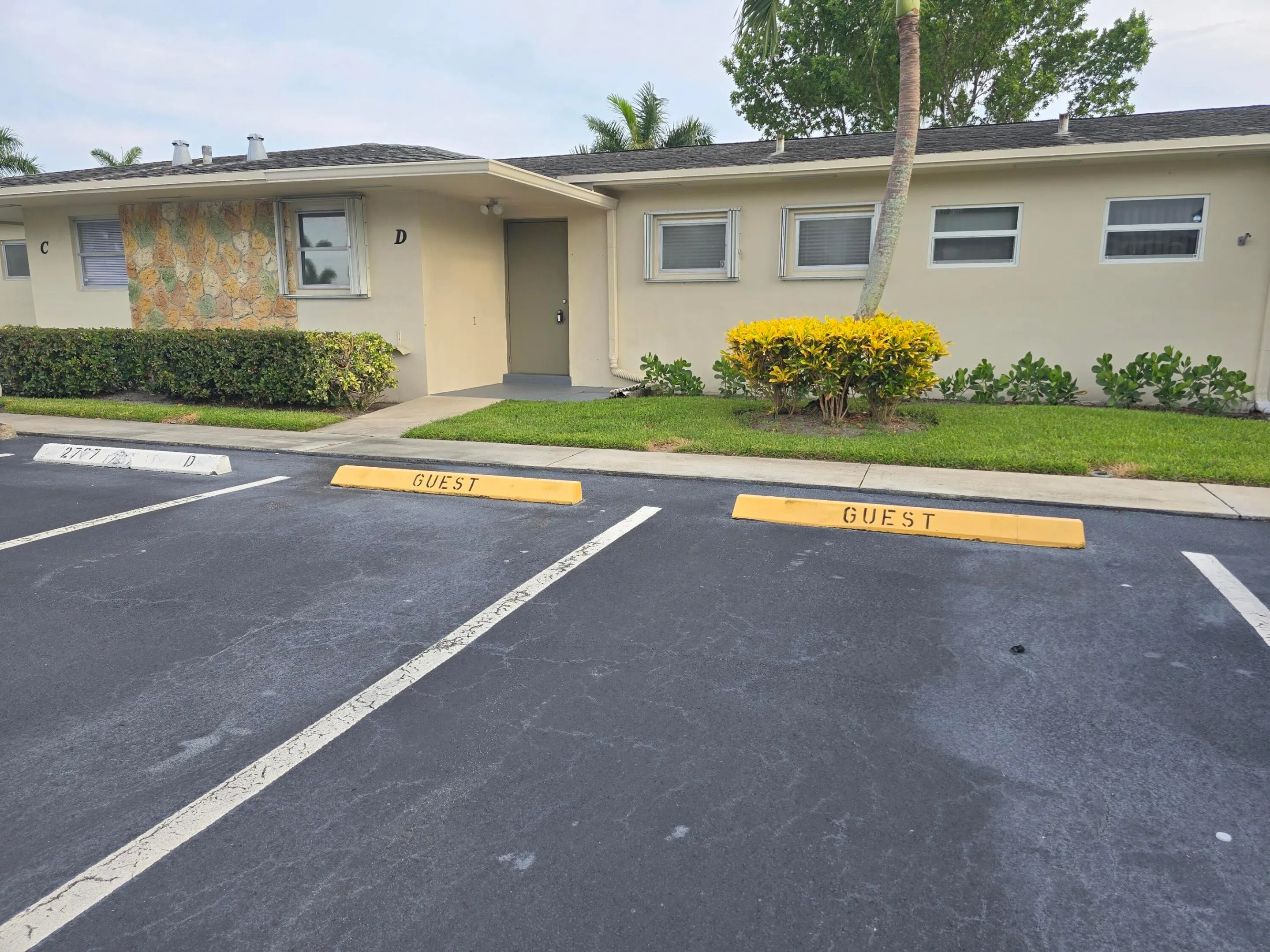 parking with two guest spots in front of unit
