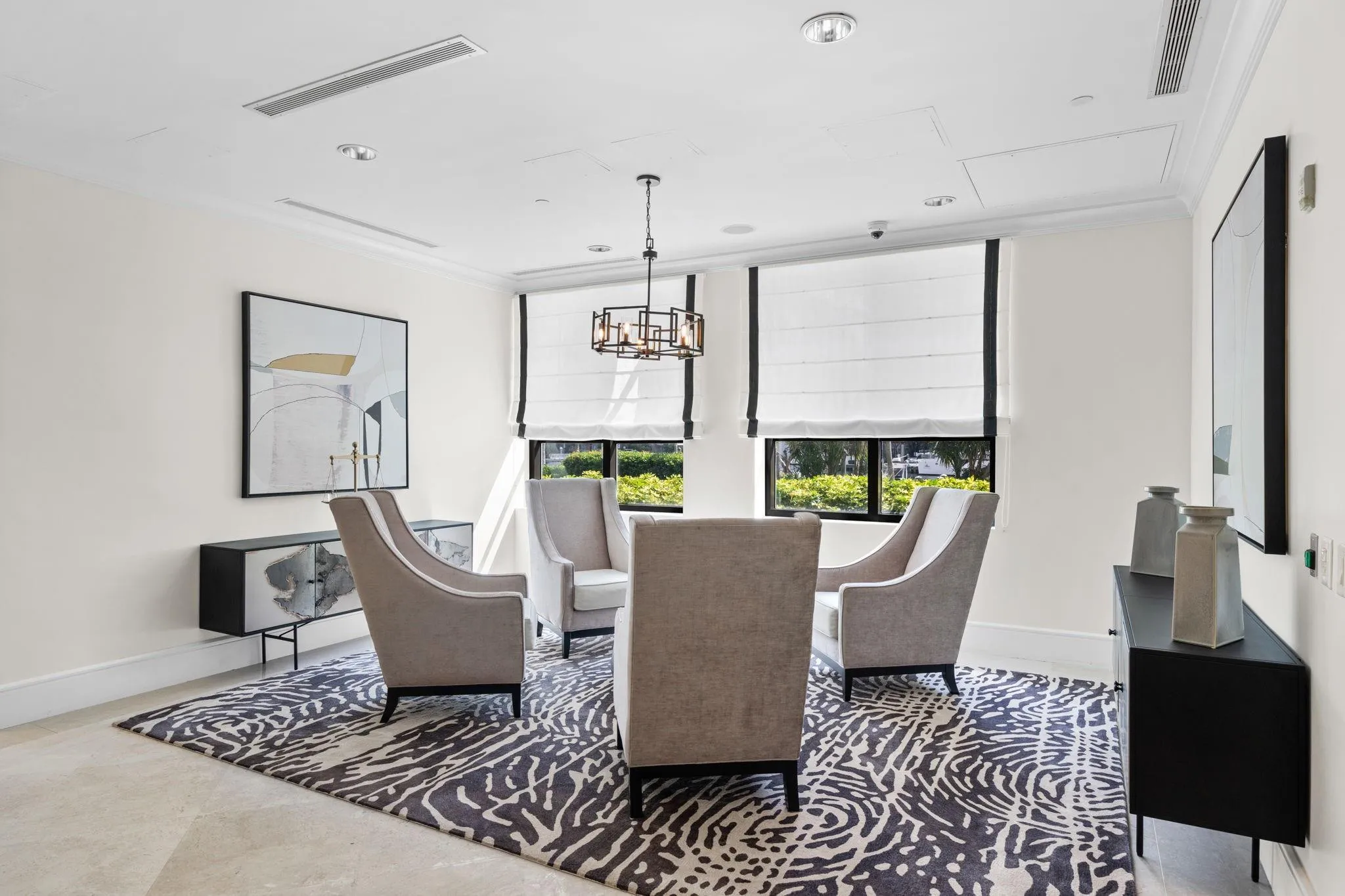 Comfortable business lounge offering seating, natural light & an inviting place to work or meet.