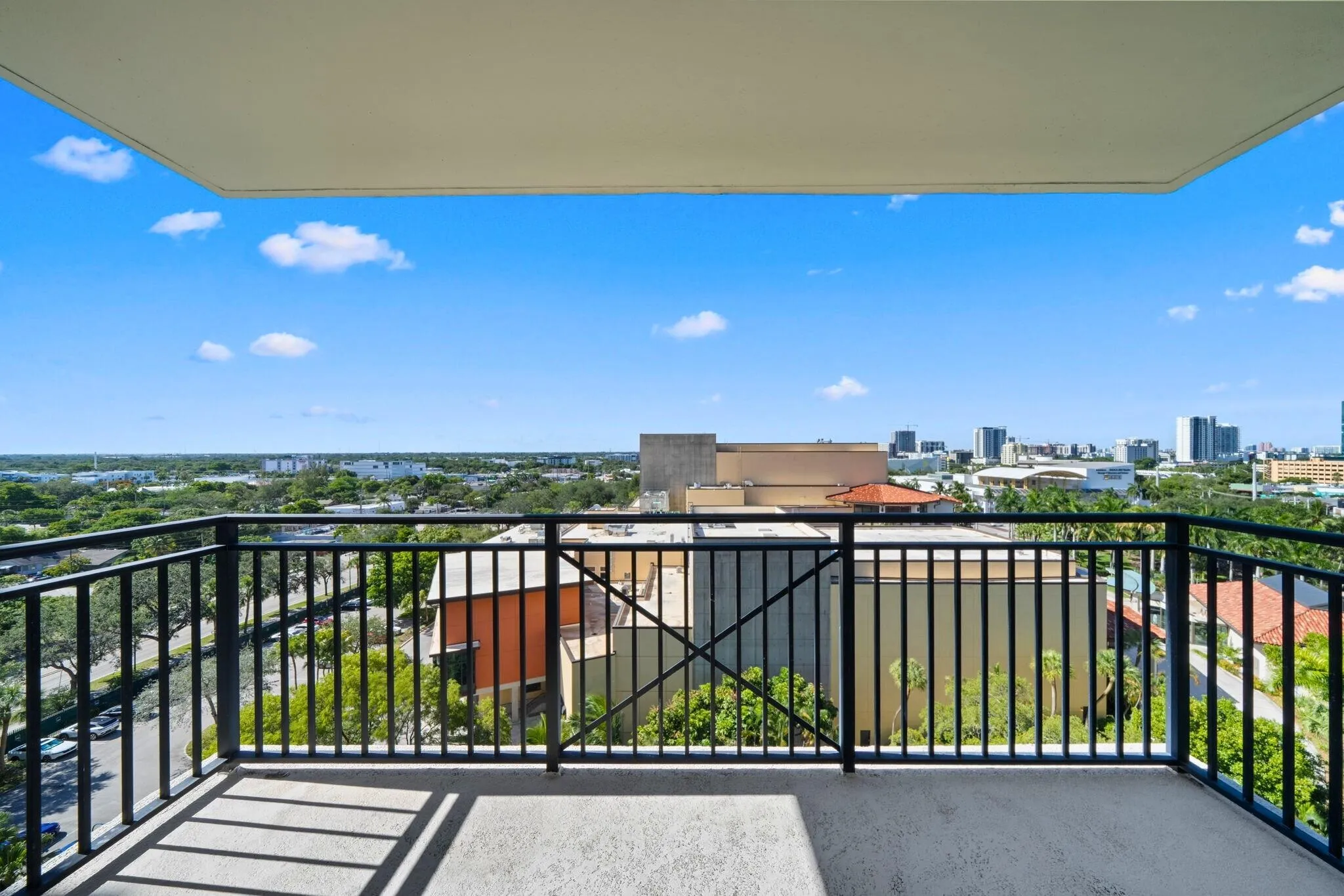 Covered private terrace off the second suite with open views across the surrounding neighborhood, New River corridor & downtown skyline.
