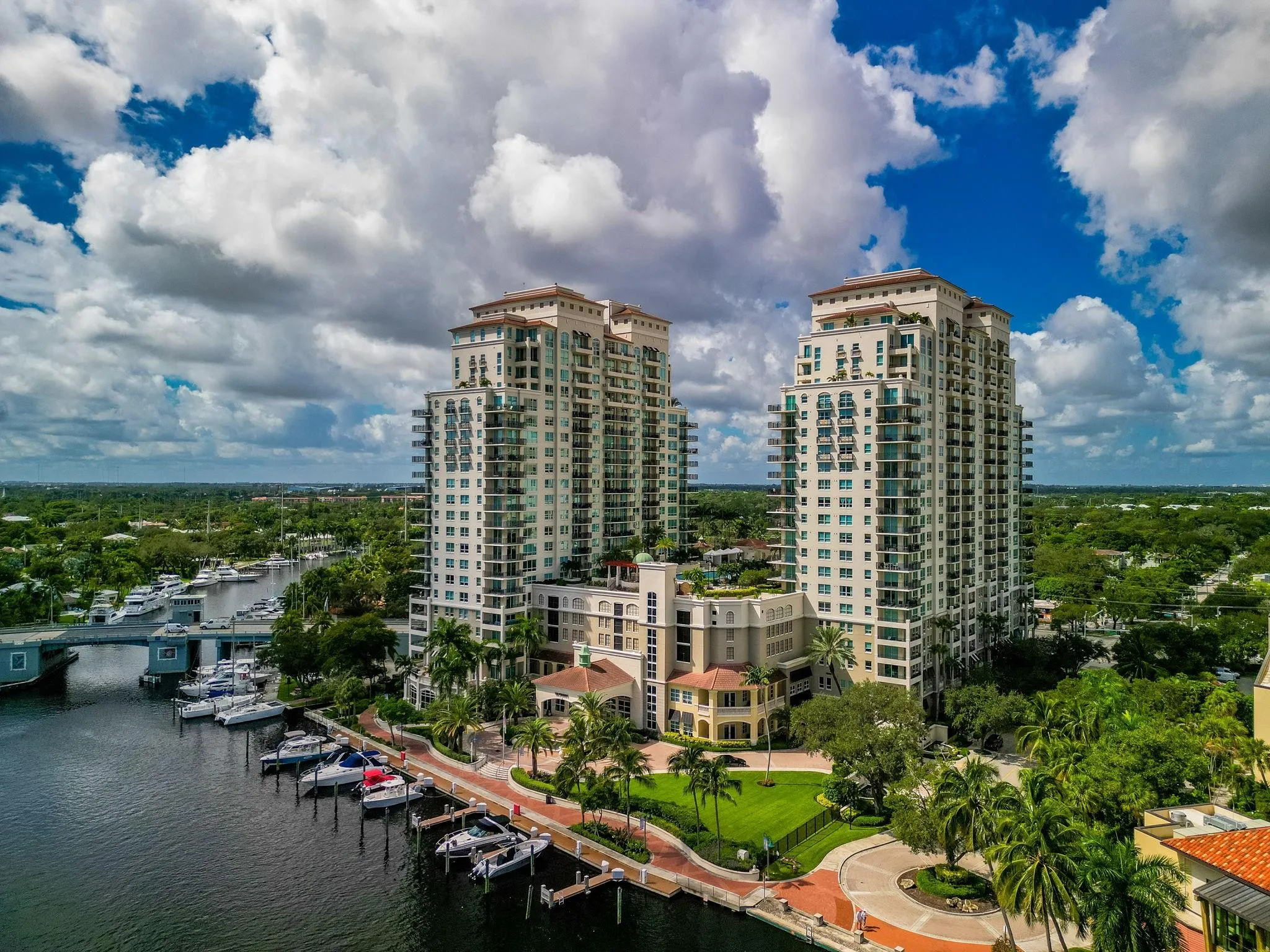 Wide aerial perspective of The Symphony’s towers, landscaped grounds, marina & direct connection to the New River.