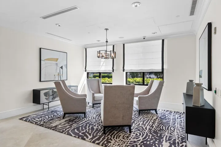 Comfortable business lounge offering seating, natural light & an inviting place to work or meet.