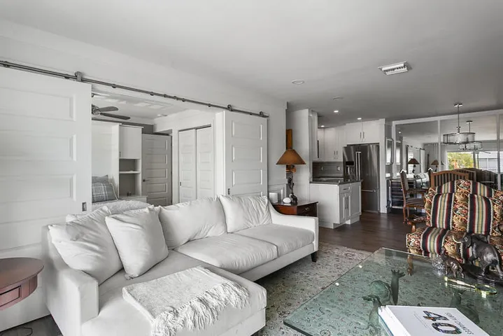Living Room with Bedroom Doors Open
