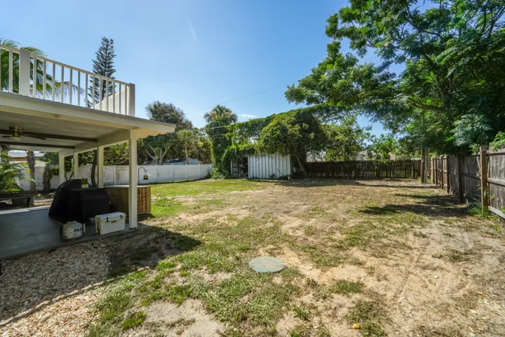 view of the detached metal garage in the rear west corner