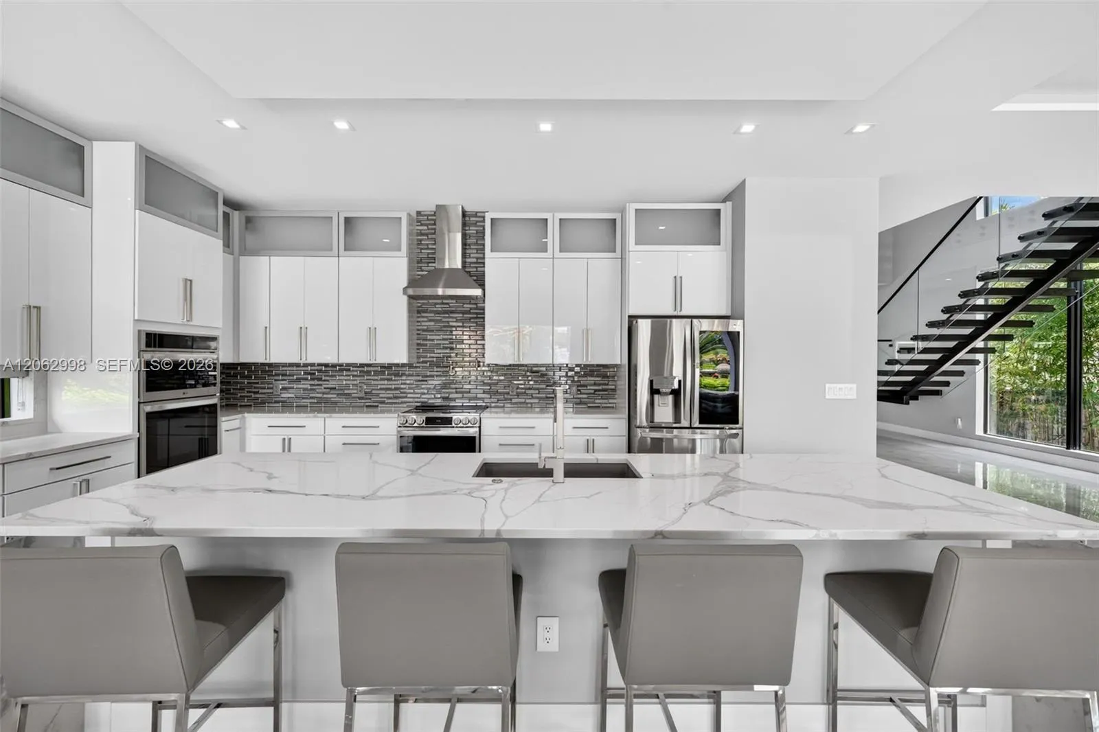 Chef's kitchen w/ counter seating, quartz waterfalls, 2 ovens, pot filler, tons of storage, KraftMaid cabinets