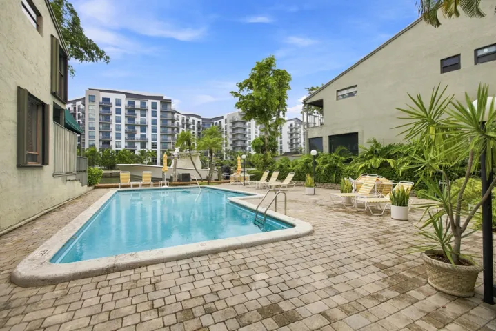 Outdoor swimming pool surrounded by paver patio