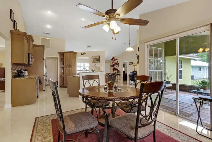 Dining room overlooks patio and yeard