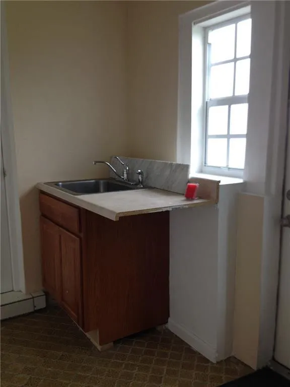 Utility sink with stainless steel basin and chrome faucet set