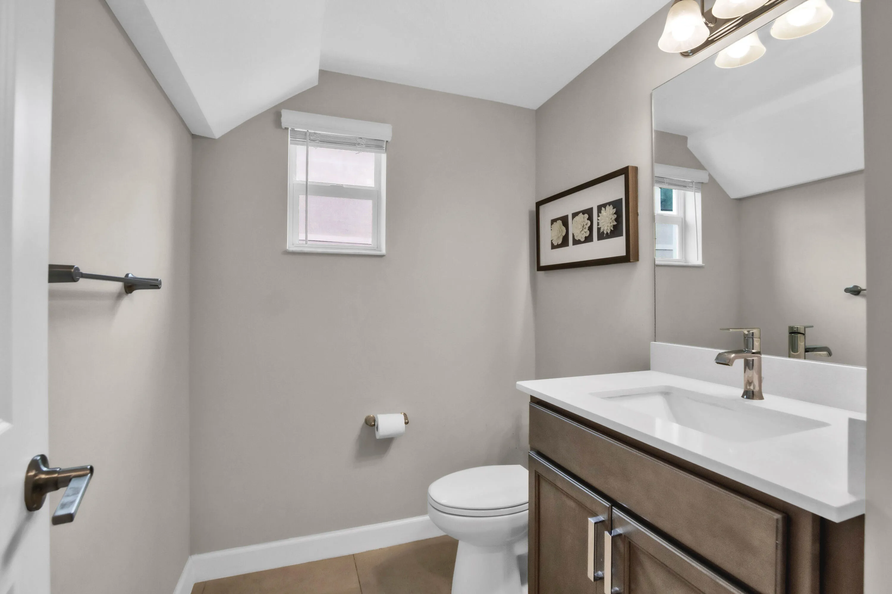 Stylish powder room is conveniently located on the main floor for guests.