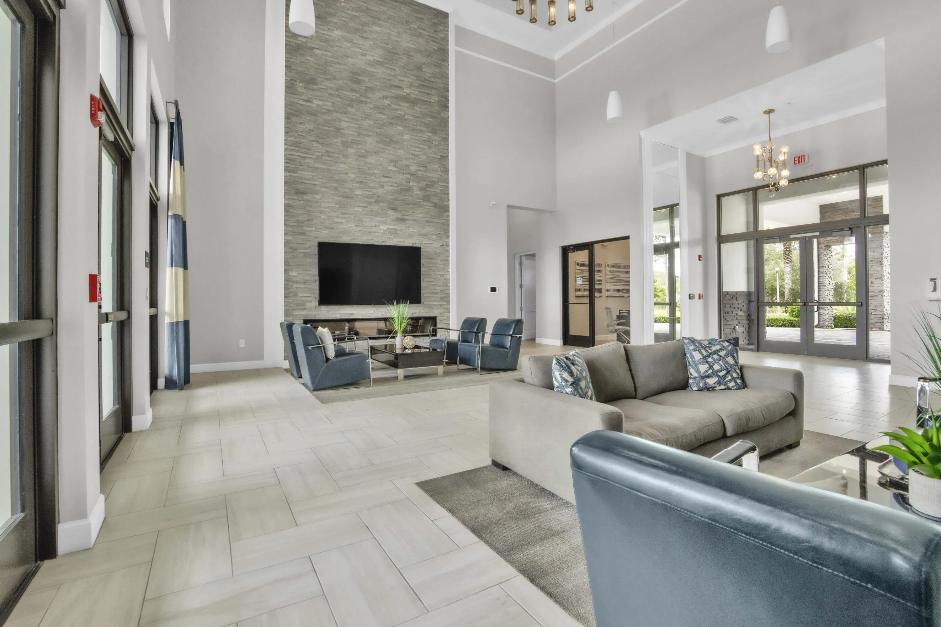 The elegant clubhouse lobby features soaring ceilings, comfortable seating, and a welcoming atmosphere.