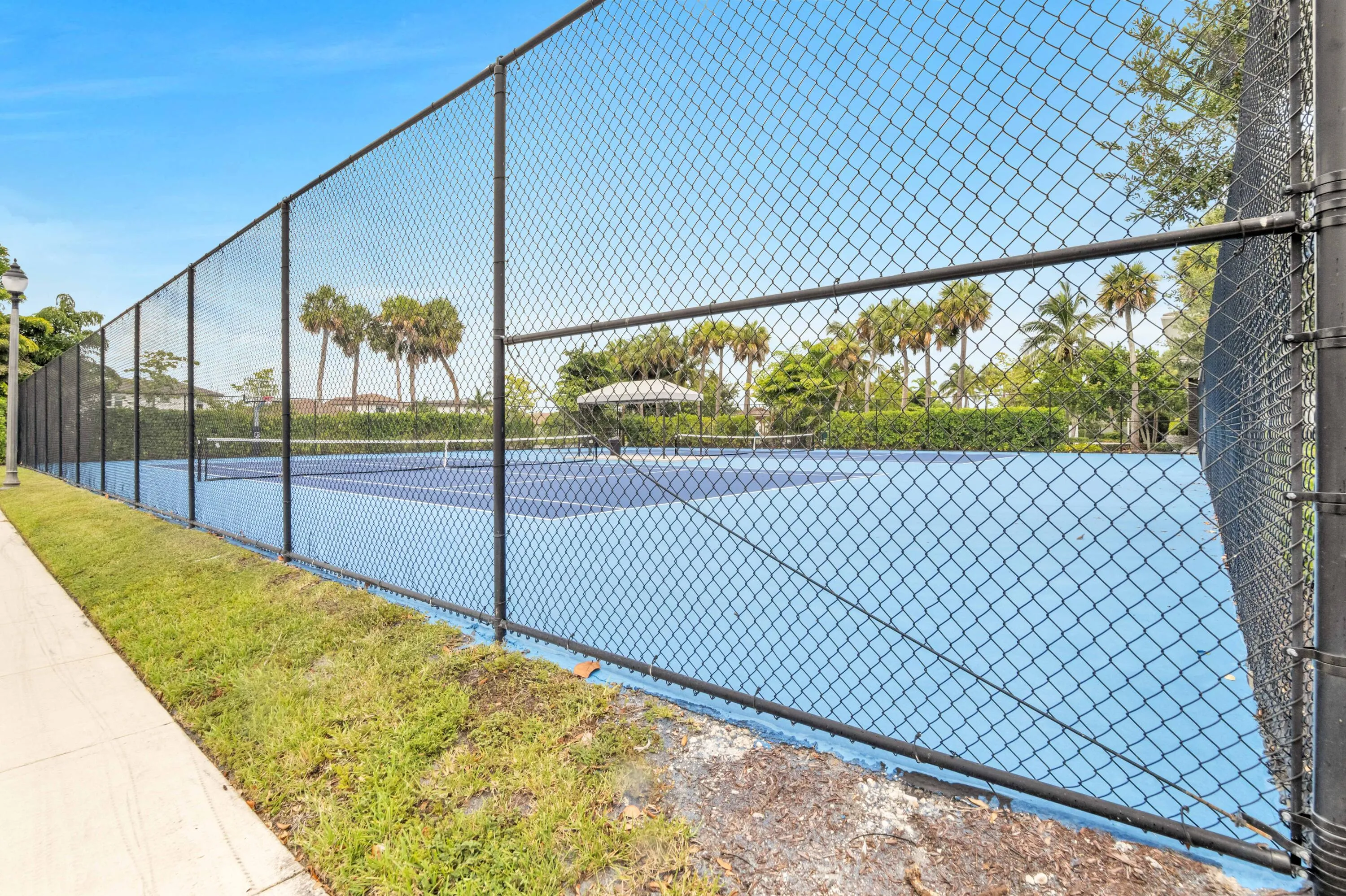 Lighted tennis courts are also included.