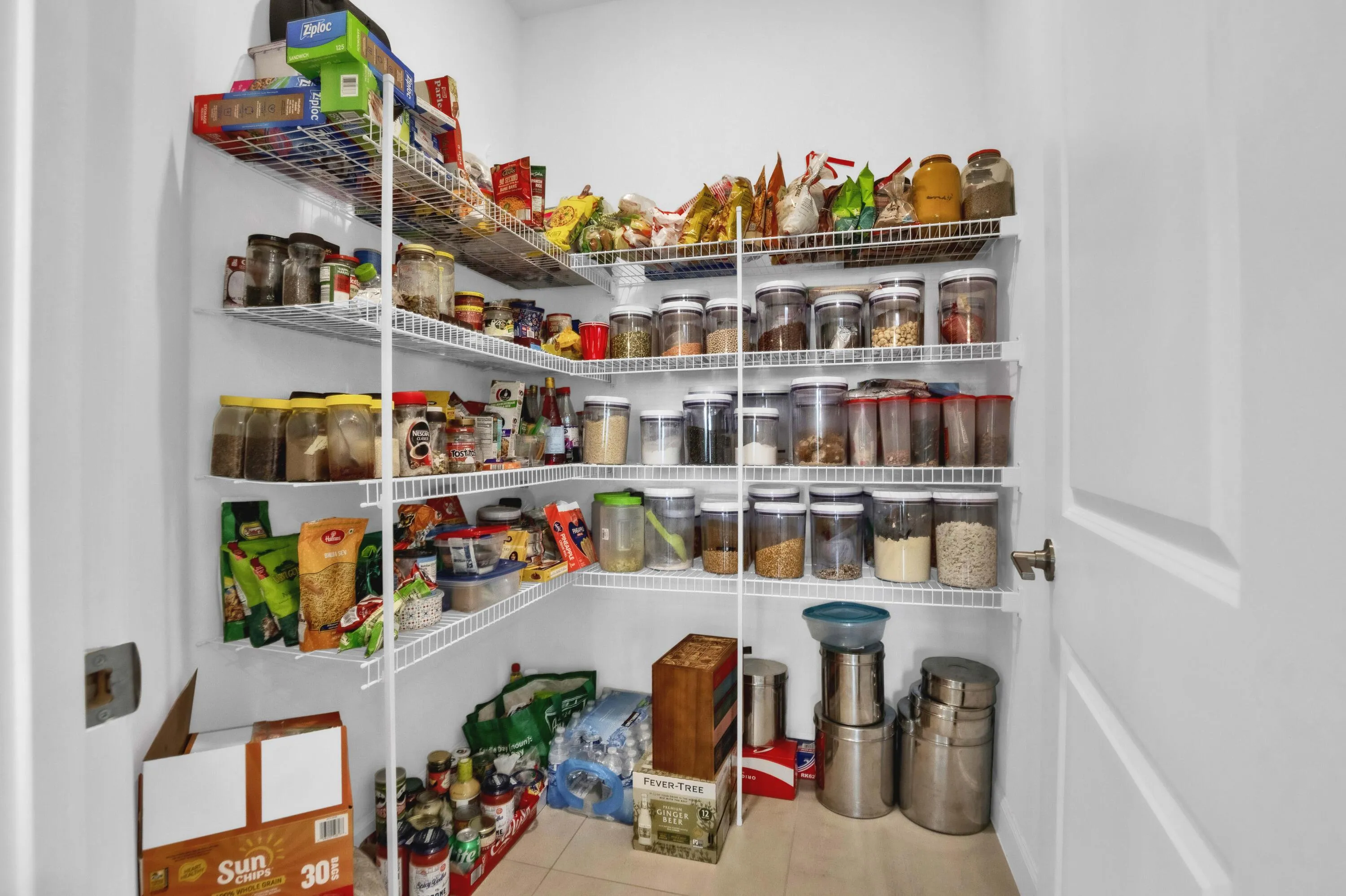The large walk-in pantry offers exceptional storage for groceries and kitchen essentials.