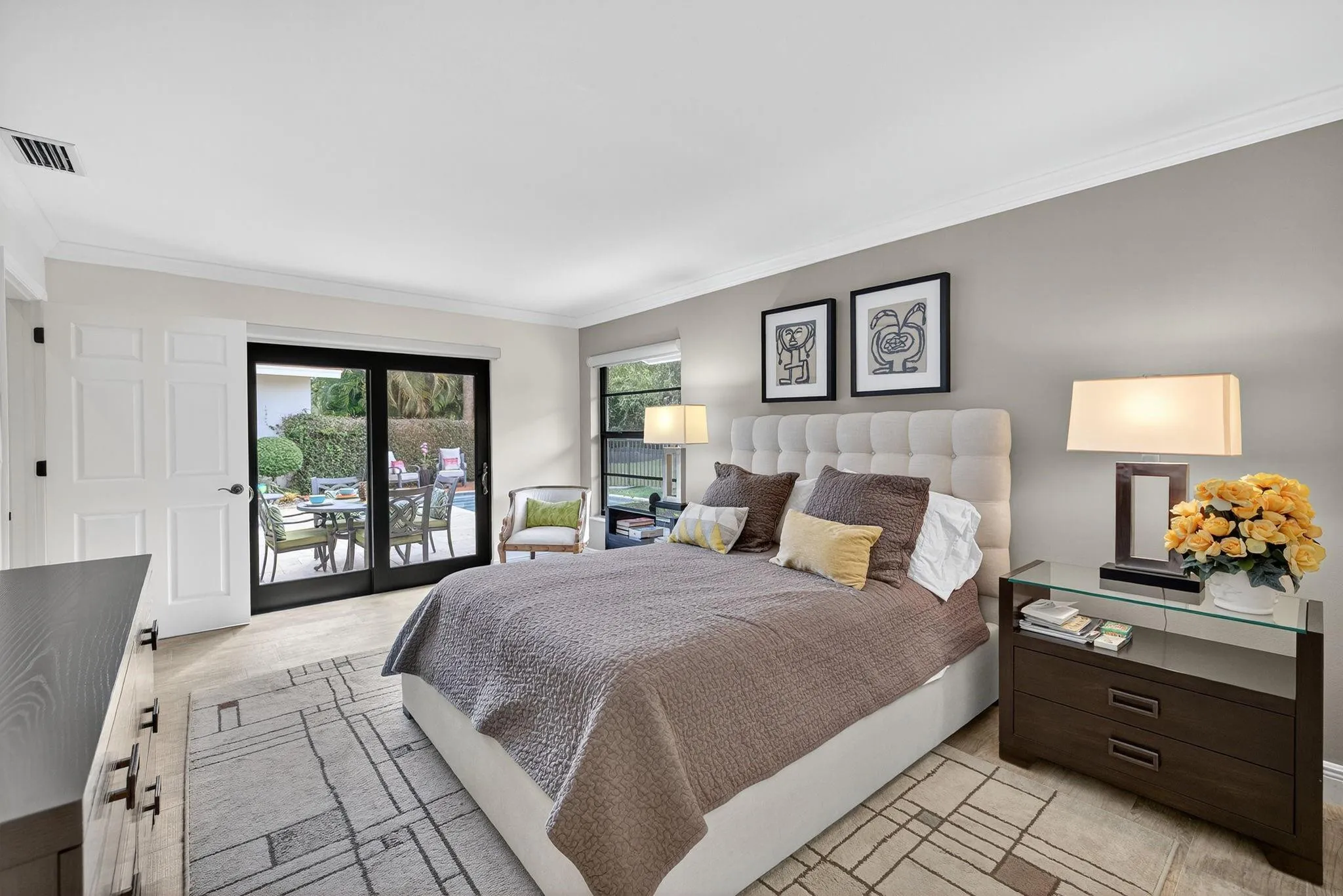 Sleek and updated corner primary bedroom.