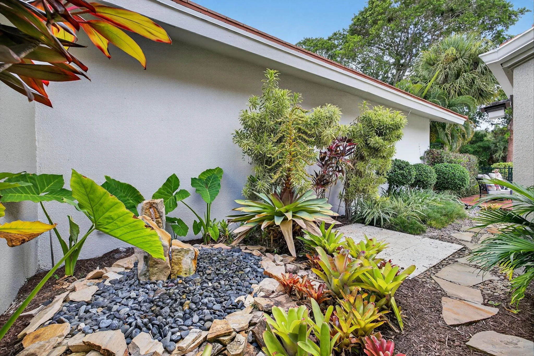 Fountain and tropical gardens.