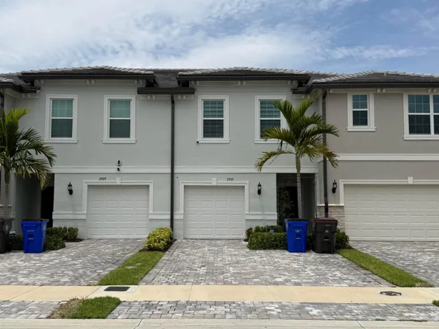 Contemporary stucco exterior with a multi-level roofline