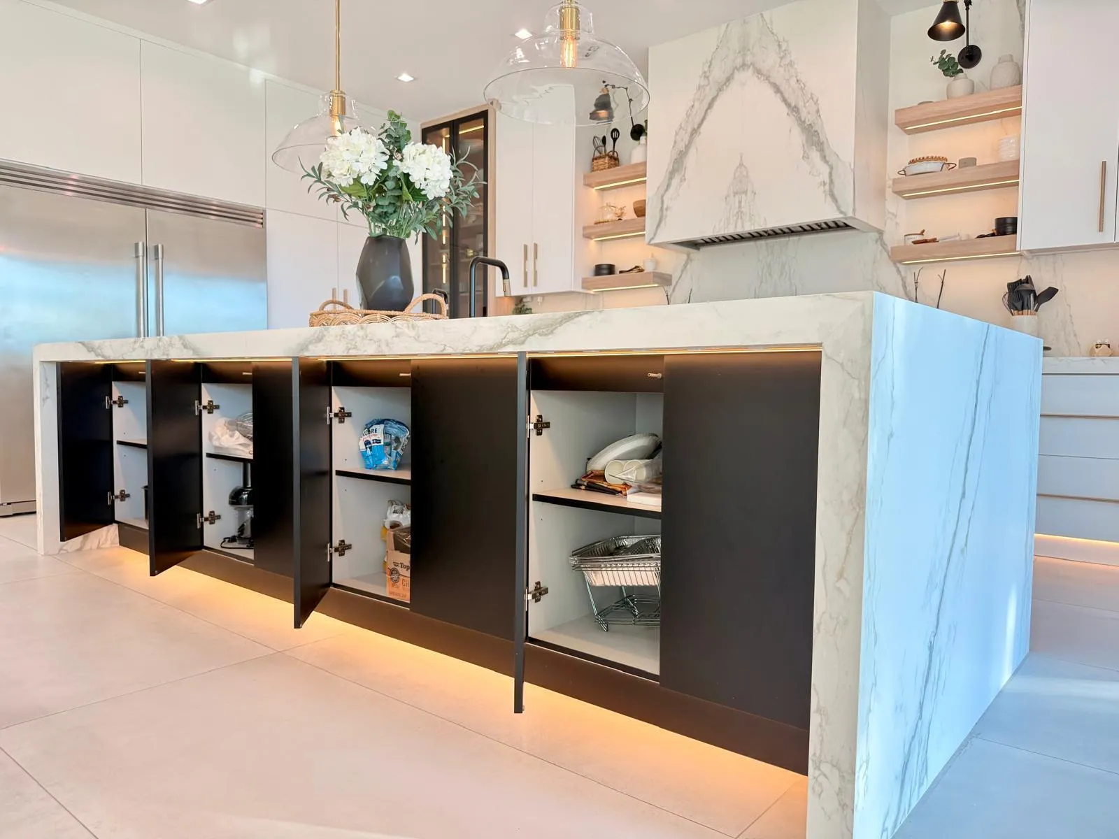 Oversized island with extensive storage, clean modern lines, and functional seating—designed for both entertaining and everyday use.