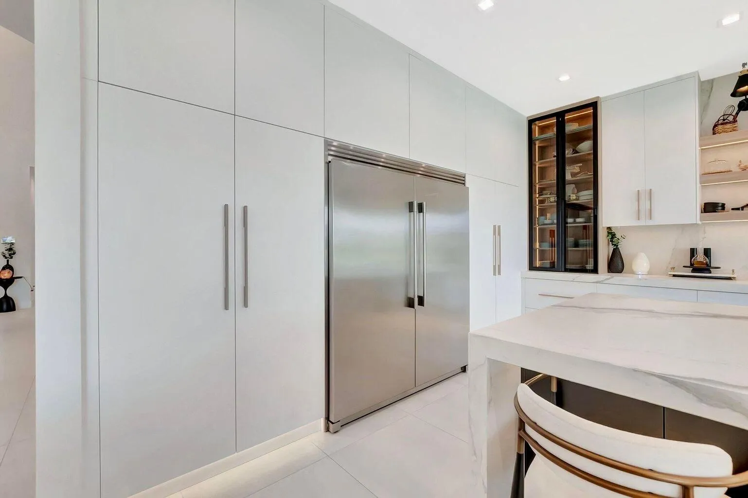 Seamlessly integrated refrigeration and custom cabinetry designed for a clean, modern aesthetic and efficient workflow.