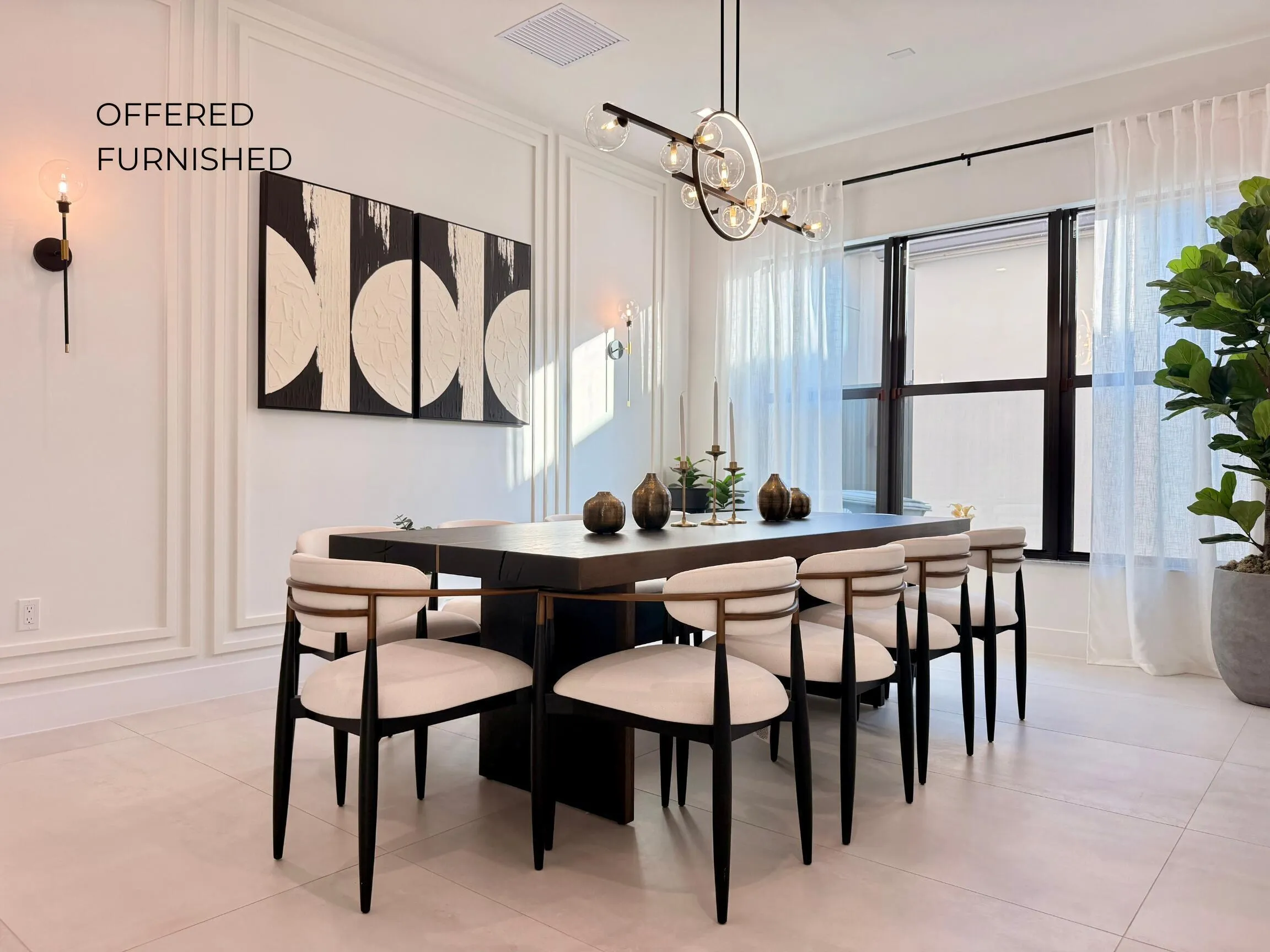 Spacious formal dining area featuring modern lighting, clean architectural lines, and seamless flow from the kitchen for entertaining.