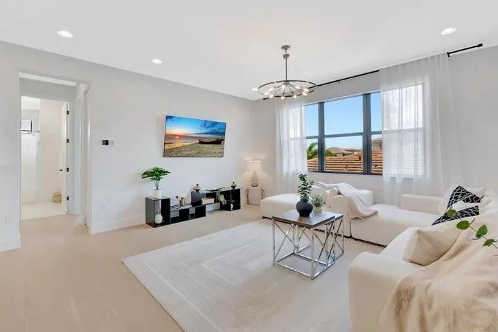 Alternate view of the upper-level loft highlighting the open layout, natural light, and versatility of the space.
